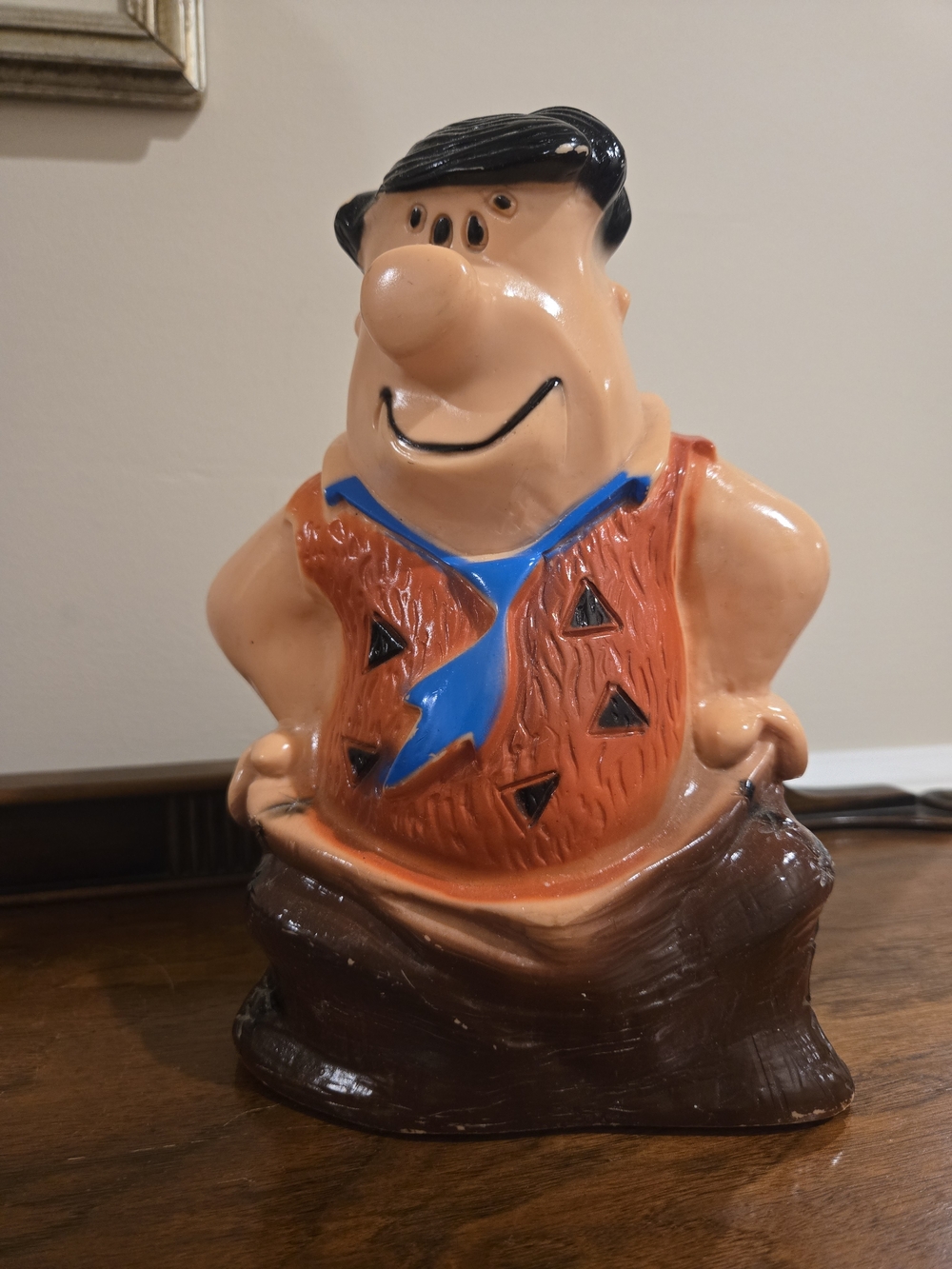 Playful Ceramic Caveman Figurine in Orange, Blue and Brown